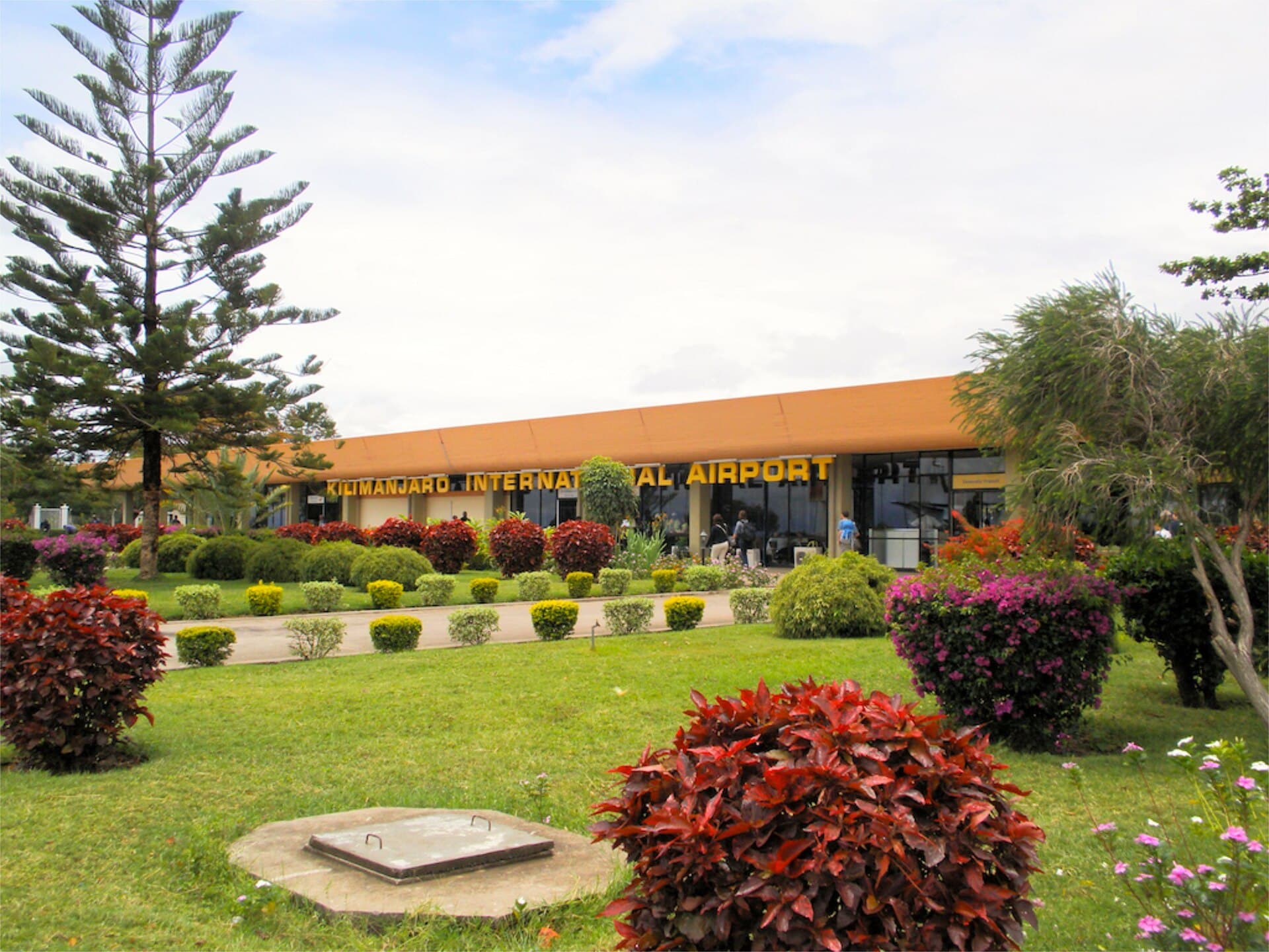 The entrance to Kilimanjaro International Airport in Tanzania, framed by garden planting