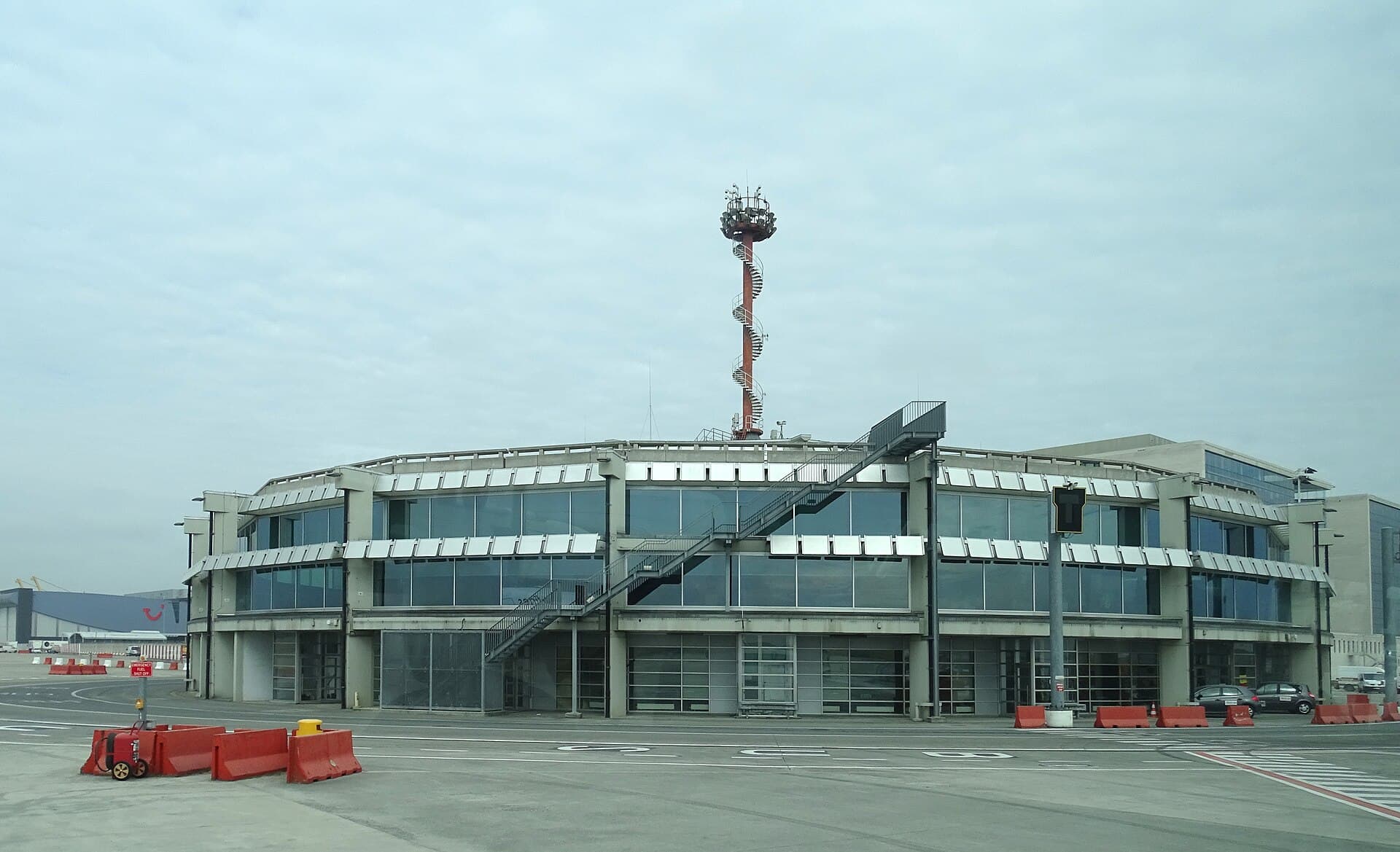 A terminal building with a control mast on the apron at Brussels Airport, Zaventem