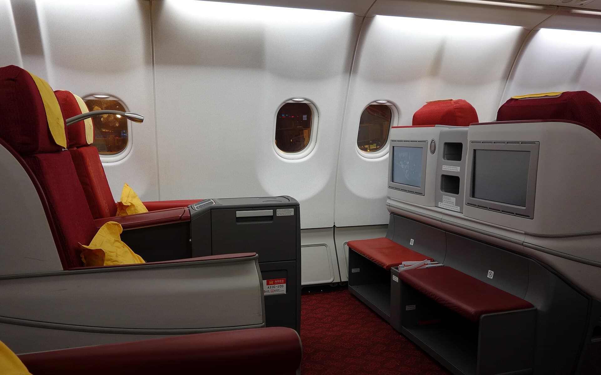 Empty seats and windows inside an aircraft cabin
